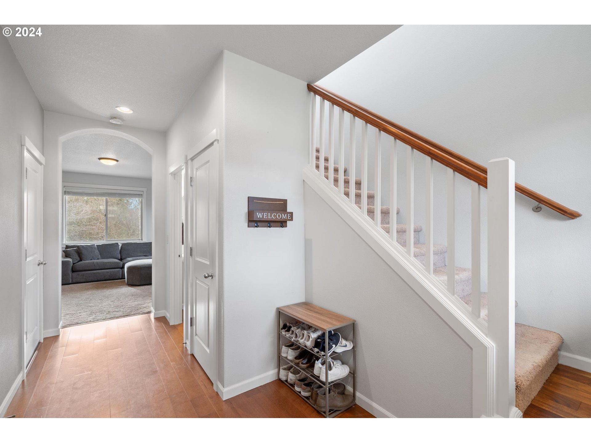 3519 North 6th Circle Ridgefield, WA 98642 - Photo 4 of 40 a view of a hallway with wooden floor and stairs