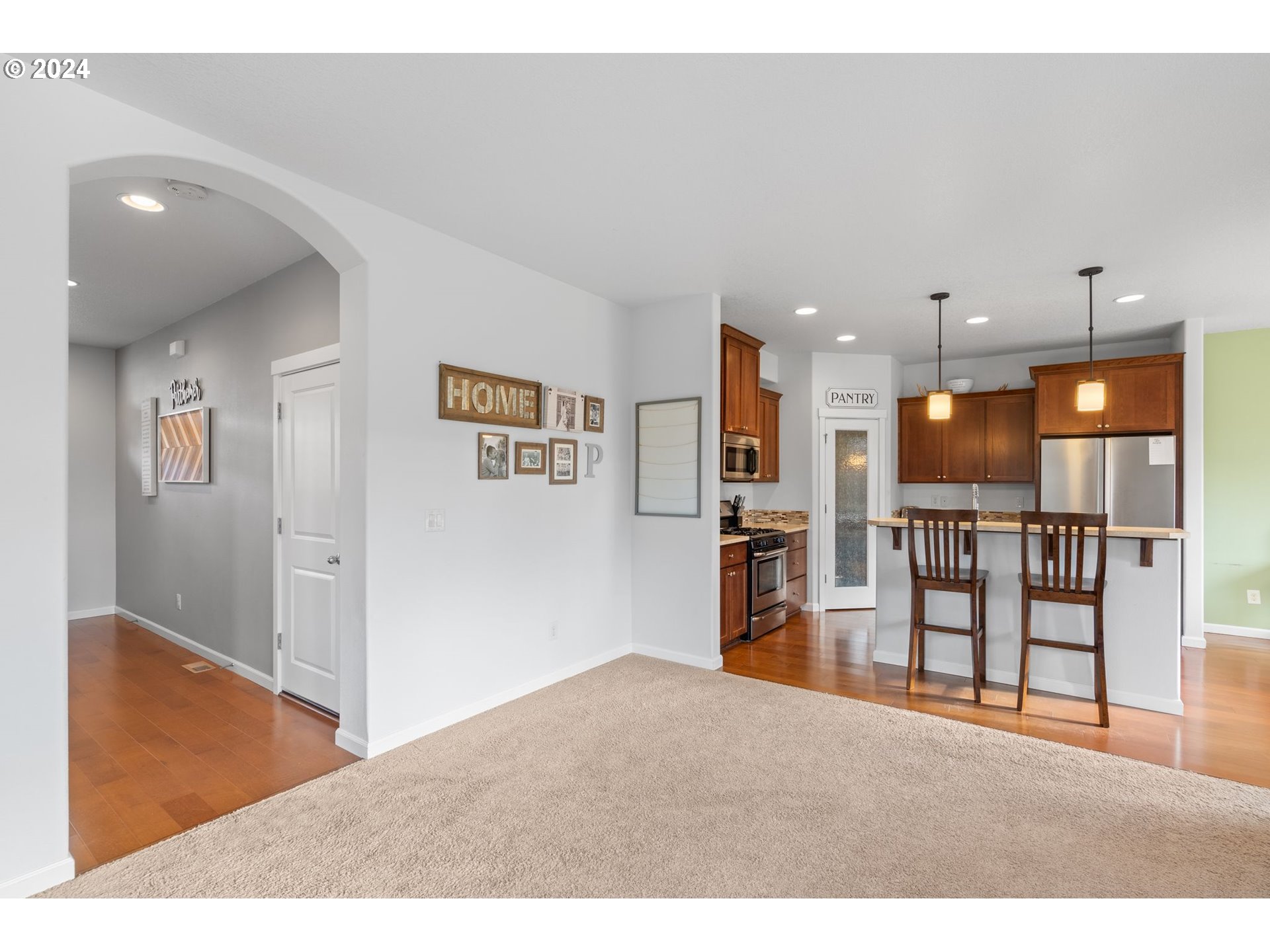 3519 North 6th Circle Ridgefield, WA 98642 - Photo 5 of 40 a open hall with cabinets and wooden floor
