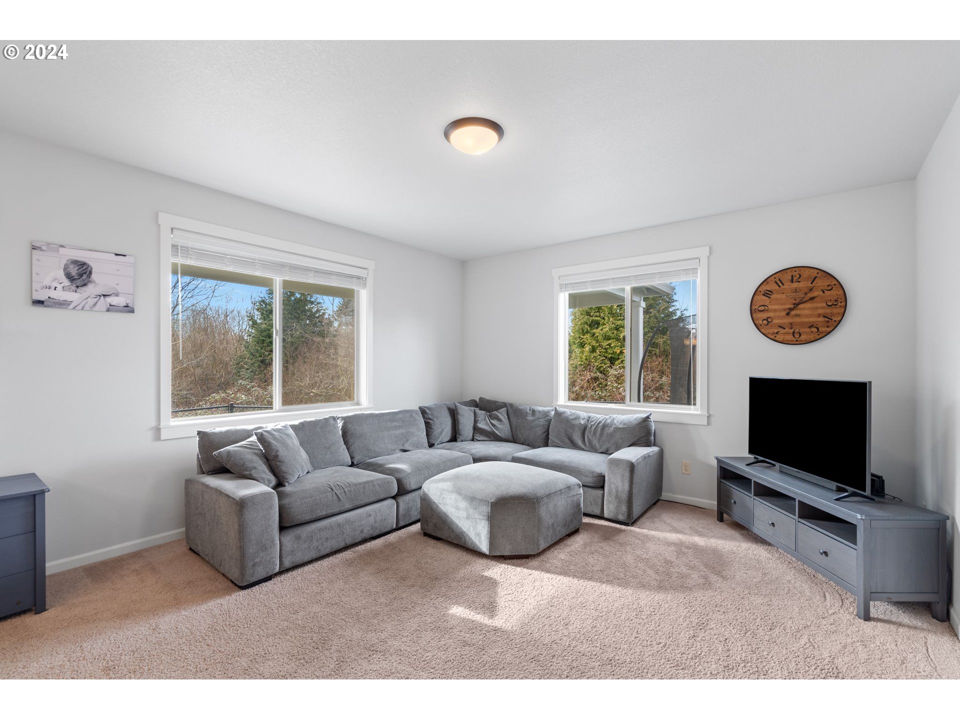 3519 North 6th Circle Ridgefield, WA 98642 - Photo 7 of 40 a living room with couches and a flat screen tv