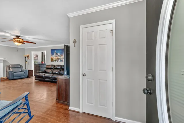 a view of a livingroom with furniture and a window