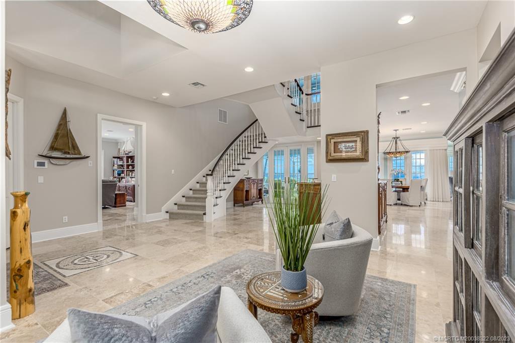 1455 Southeast Riverside Drive Stuart, FL 34996 - Photo 46 of 100 a living room with furniture and a potted plant