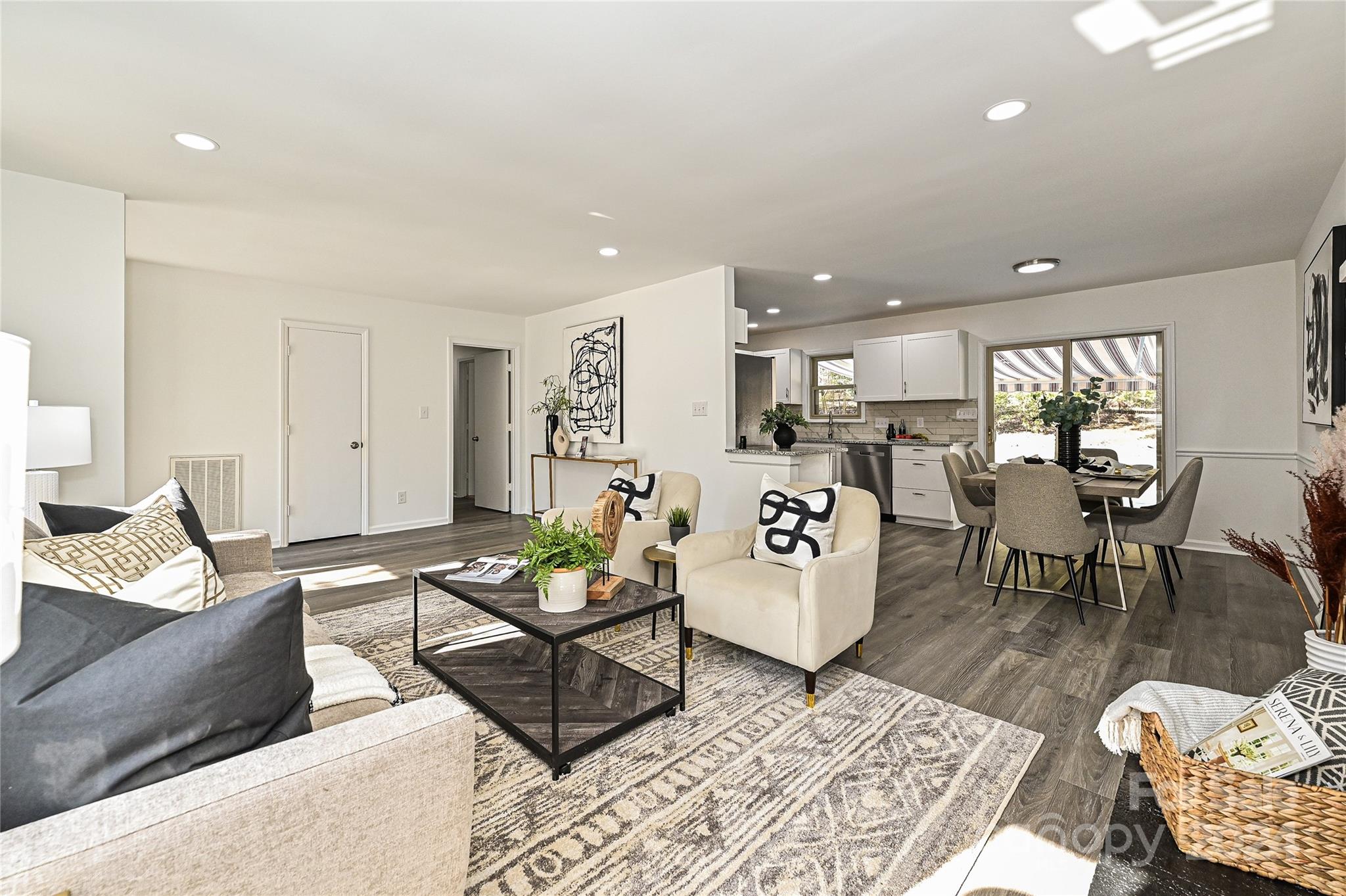 8617 Pine Circle Charlotte, NC 28215 - Photo 1 of 30 a living room with furniture and kitchen view