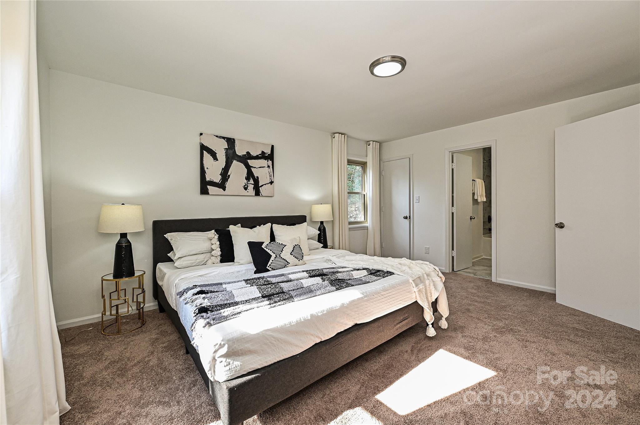 8617 Pine Circle Charlotte, NC 28215 - Photo 16 of 30 a bed sitting in a bedroom and a table