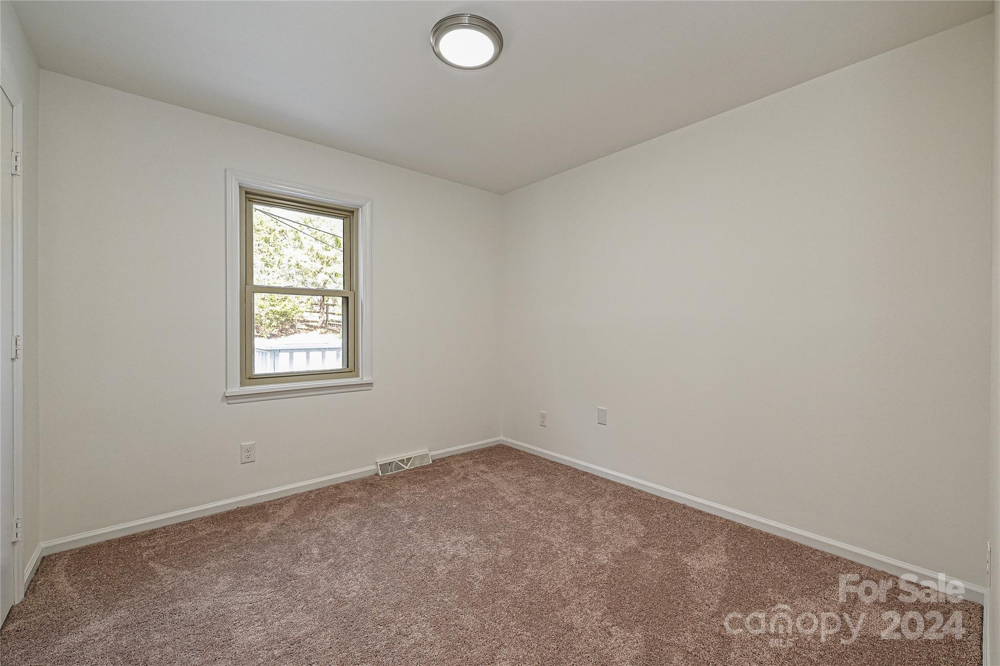 8617 Pine Circle Charlotte, NC 28215 - Photo 21 of 30 an empty room with a window