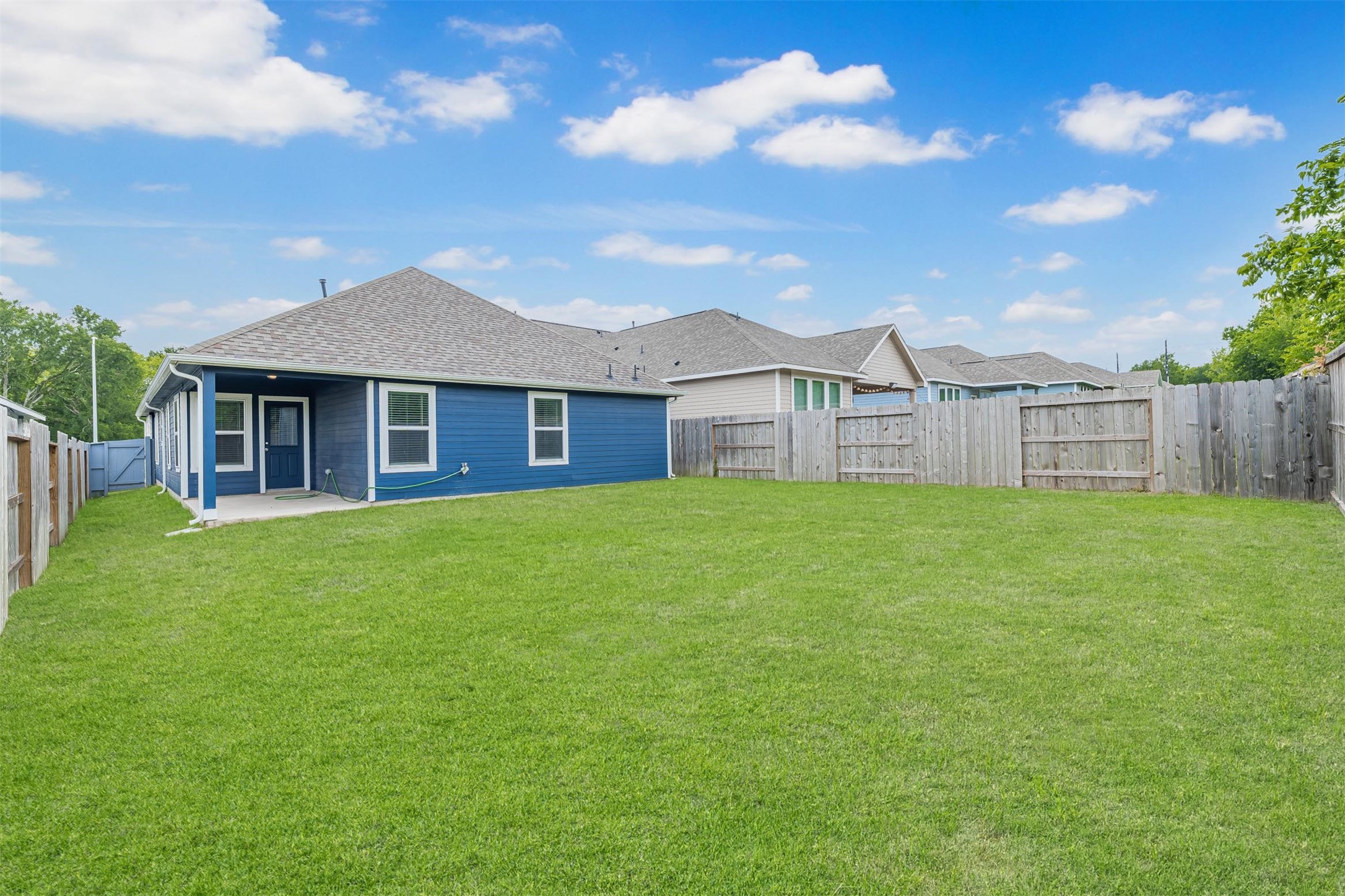 33118 School Hl Road Fulshear, TX 77441 - Photo 18 of 18 Spacious backyard with covered patio