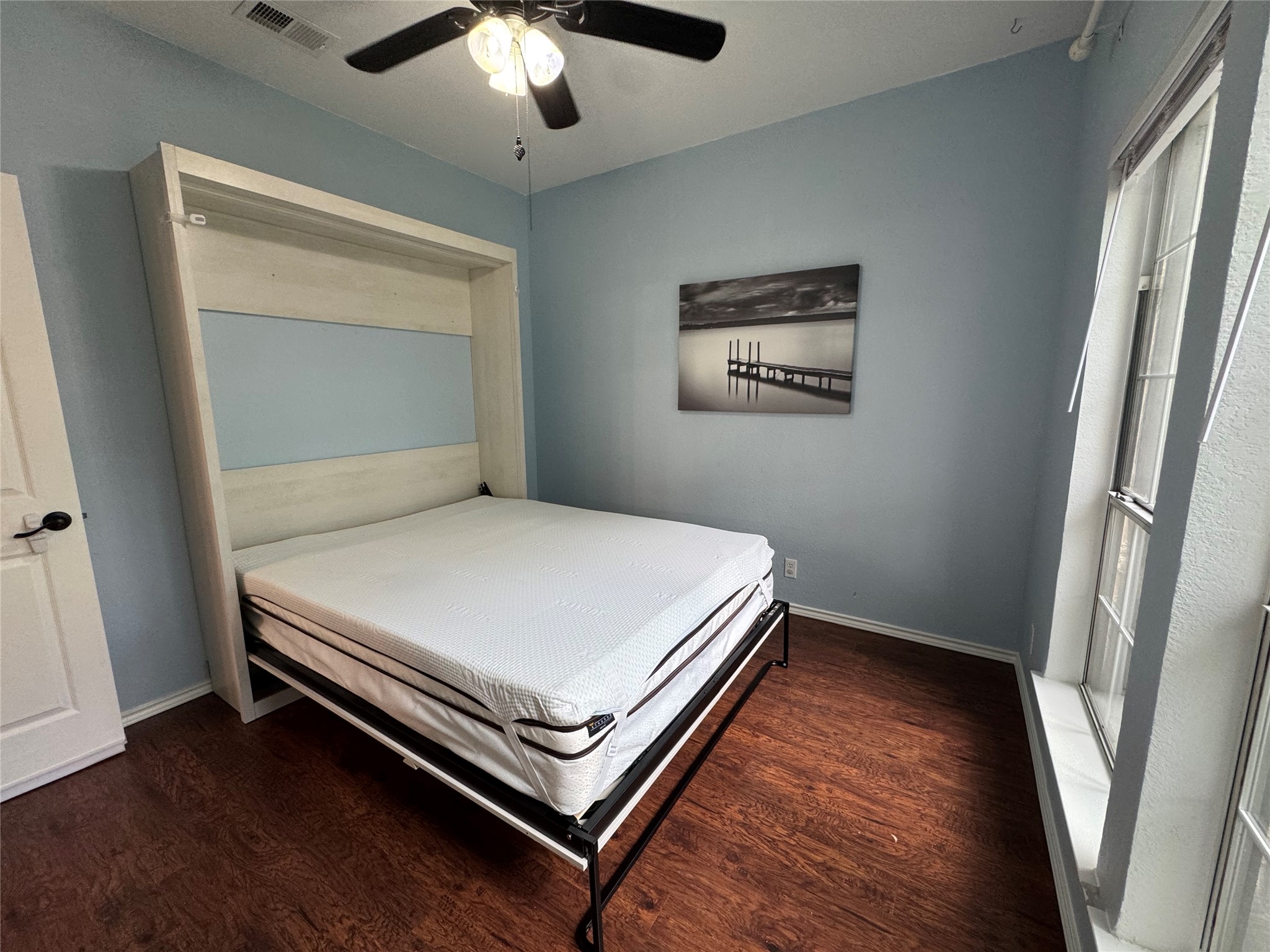 3809 Spicewood Springs Road, Unit 137 Austin, TX 78759 - Photo 18 of 34 A clever murphy bed system maximizes floor space in this well-appointed room.
