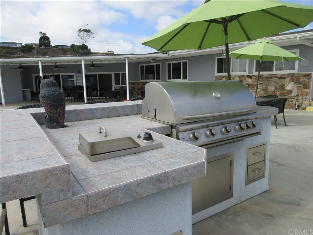 102 Sandy Drive San Clemente, CA 92672 - Photo 12 of 16 a table and chairs in the patio