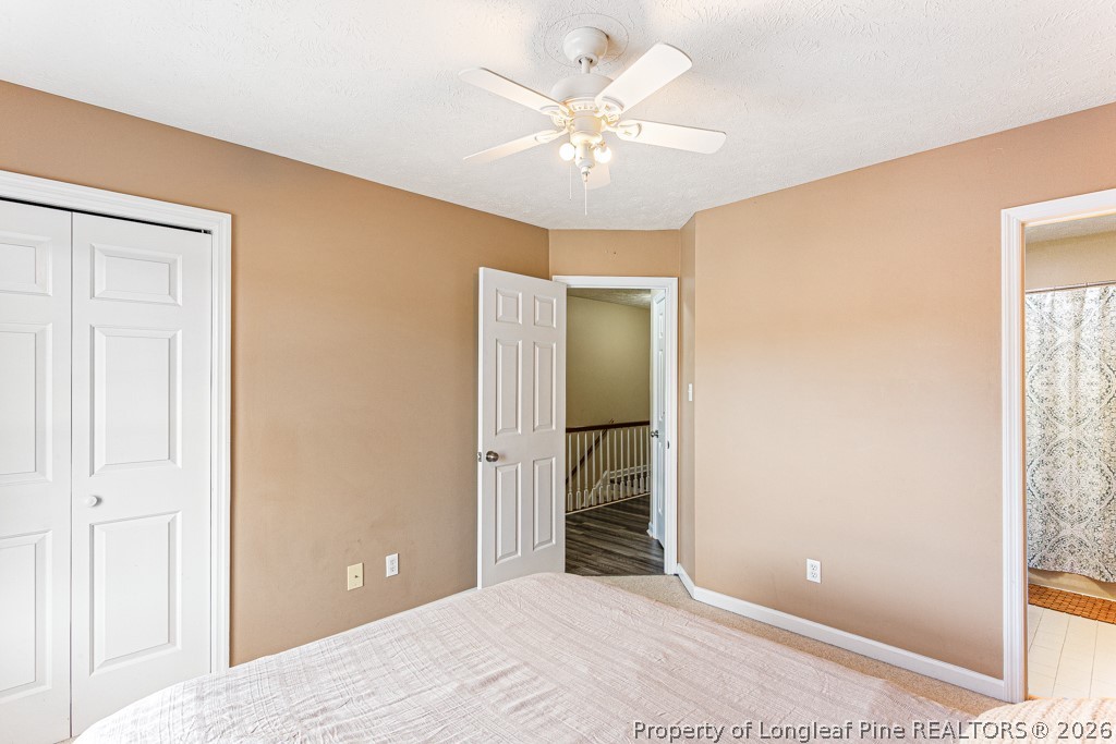 461 Lands End Road Fayetteville, NC 28314 - Photo 24 of 31 a view of a room with a ceiling fan and a bathroom