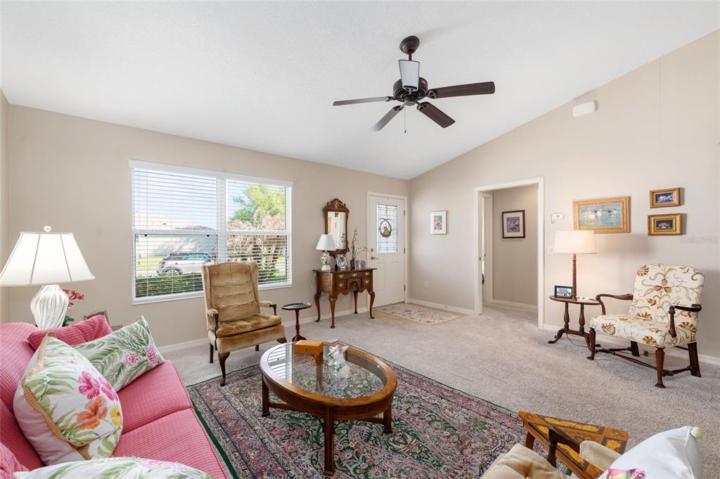 771 Fenwick Loop The Villages, FL 32163 - Photo 12 of 51 a living room with furniture and a wooden floor