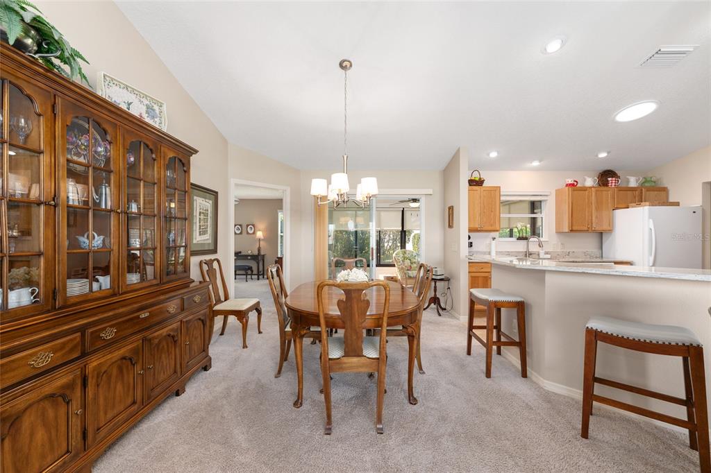771 Fenwick Loop The Villages, FL 32163 - Photo 14 of 51 a view of a dining room with furniture window and outside view