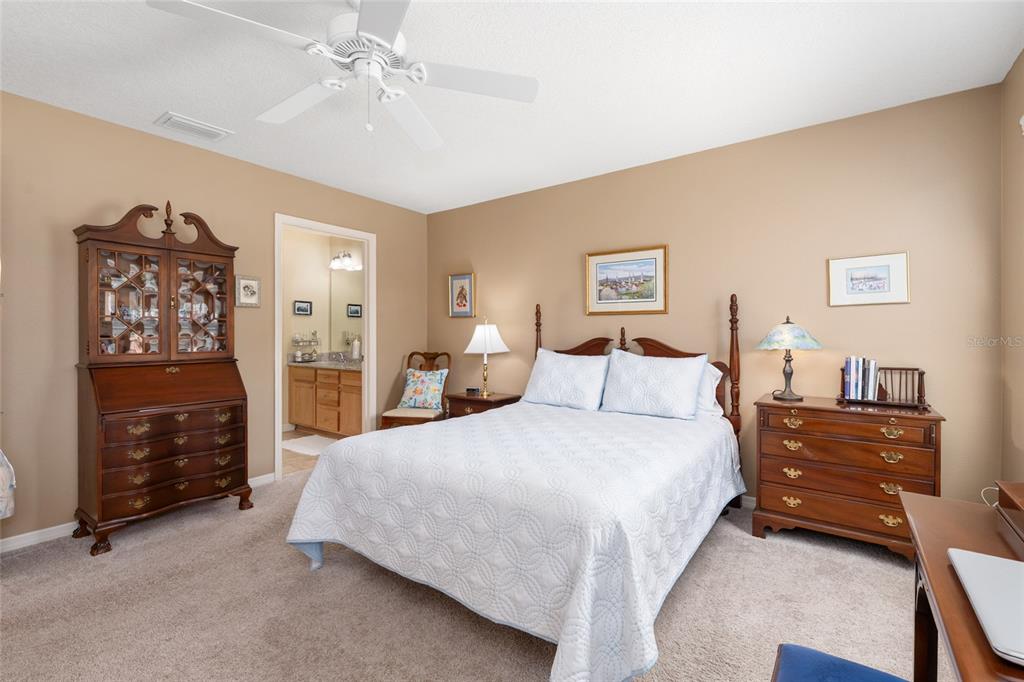 771 Fenwick Loop The Villages, FL 32163 - Photo 27 of 51 a bedroom with a bed and a cabinets