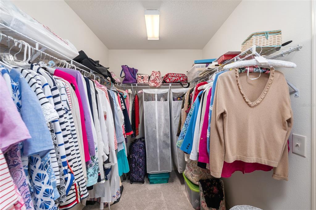 771 Fenwick Loop The Villages, FL 32163 - Photo 33 of 51 a view of walk in closet with clothes