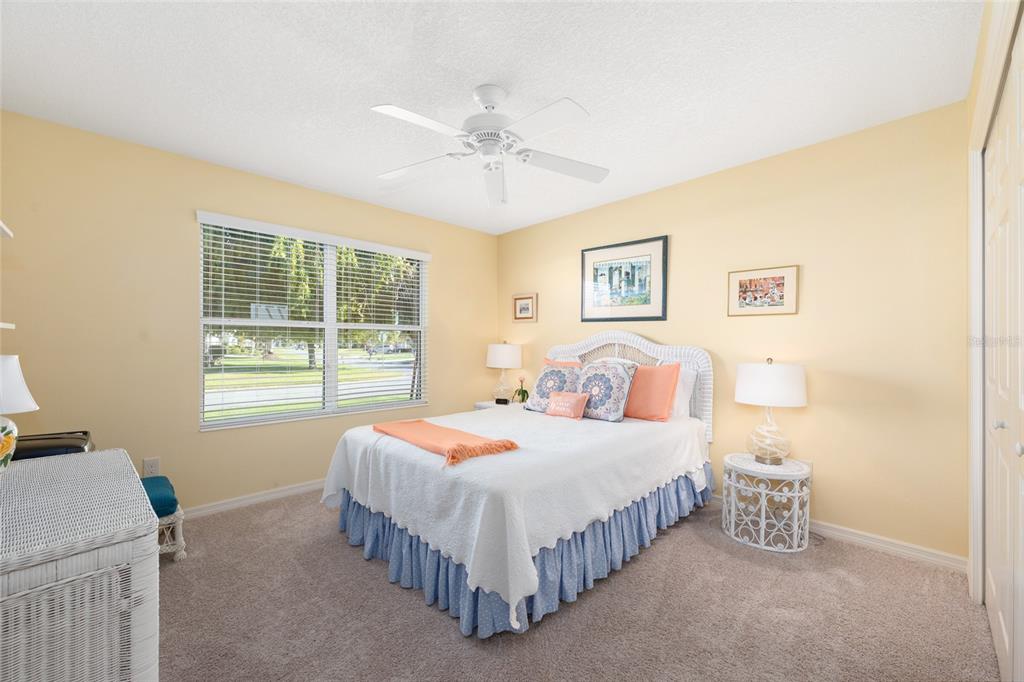 771 Fenwick Loop The Villages, FL 32163 - Photo 36 of 51 a bedroom with a bed and a table