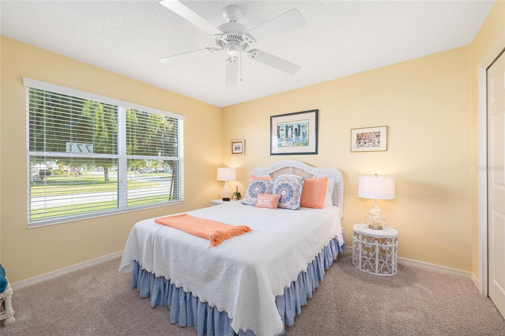 771 Fenwick Loop The Villages, FL 32163 - Photo 37 of 51 a bedroom with a bed and a table