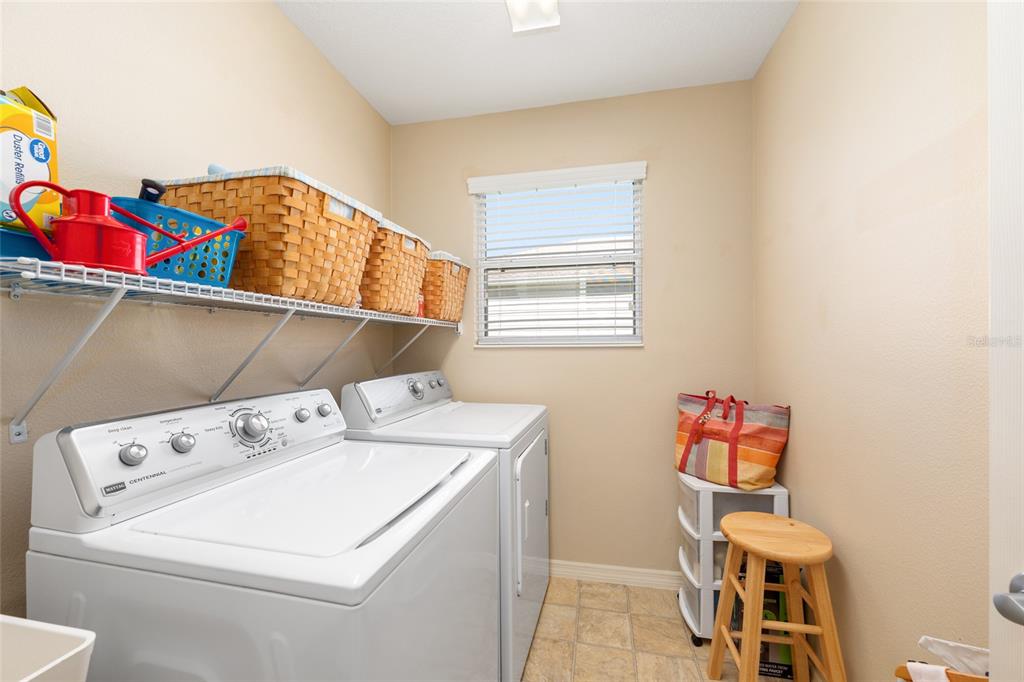 771 Fenwick Loop The Villages, FL 32163 - Photo 39 of 51 a utility room with dryer and washer