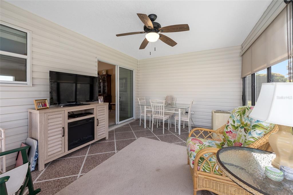 771 Fenwick Loop The Villages, FL 32163 - Photo 45 of 51 a living room with furniture a flat screen tv and kitchen view