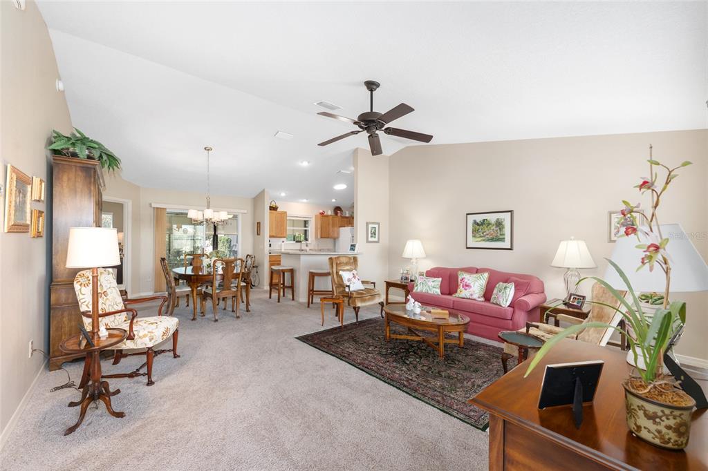 771 Fenwick Loop The Villages, FL 32163 - Photo 7 of 51 a living room with furniture and a rug