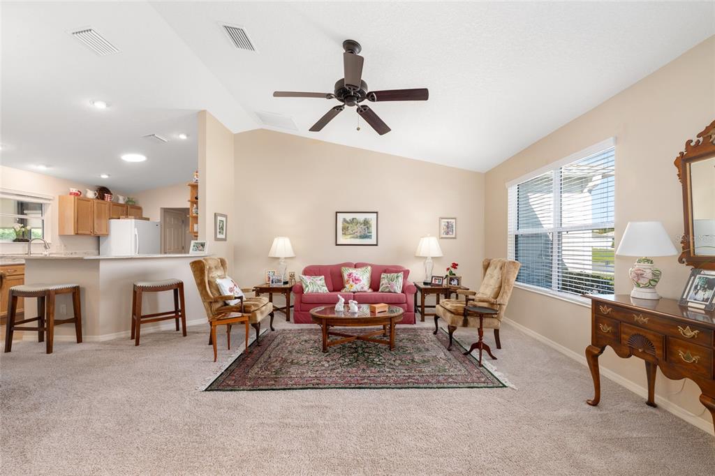 771 Fenwick Loop The Villages, FL 32163 - Photo 8 of 51 a living room with furniture a window and desk