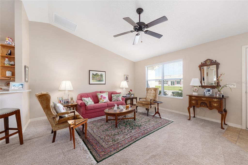 771 Fenwick Loop The Villages, FL 32163 - Photo 9 of 51 a living room with furniture and a large window