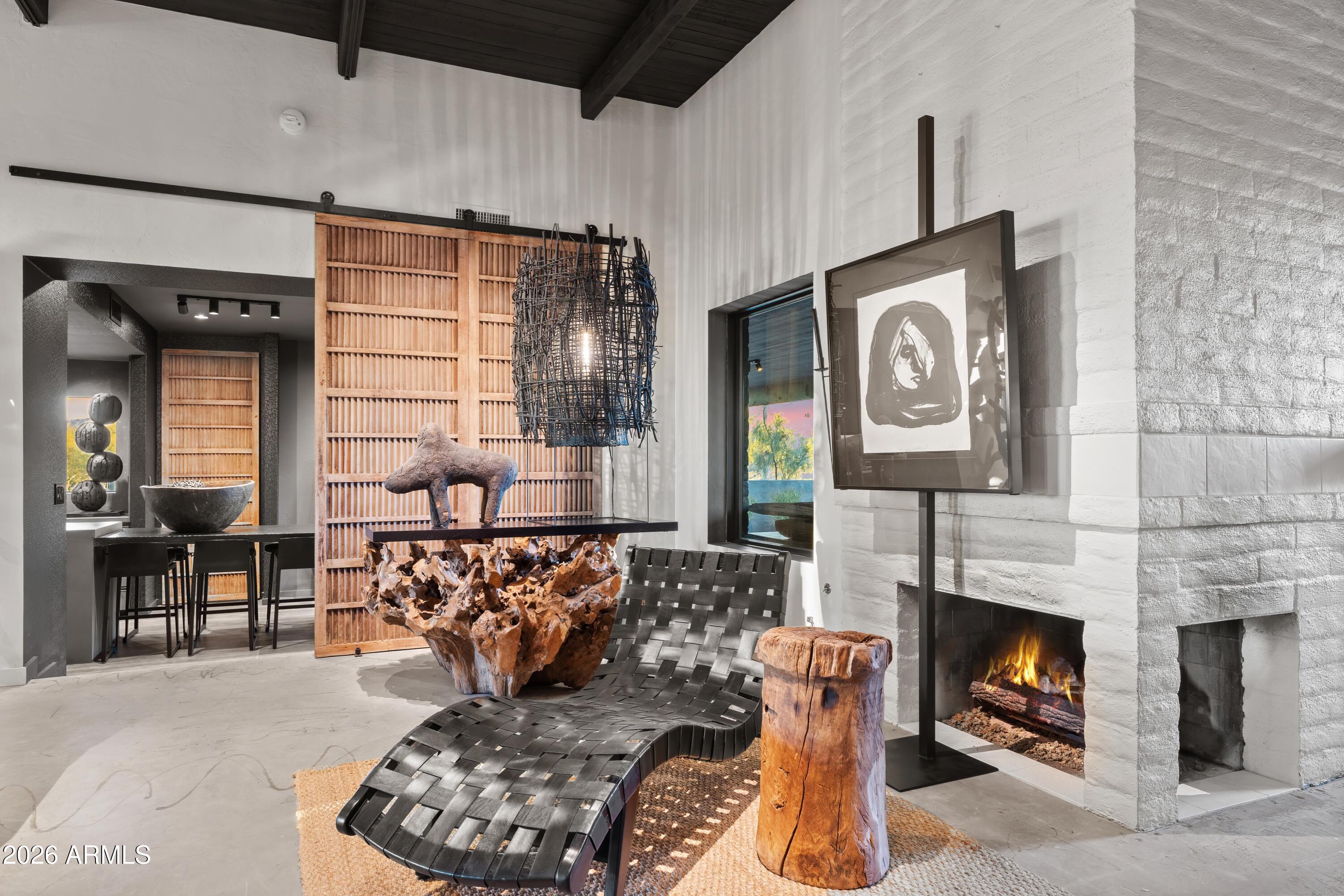 9545 East Romping Road, Unit 90 Carefree, AZ 85377 - Photo 11 of 59 a living room with furniture a fireplace and a table