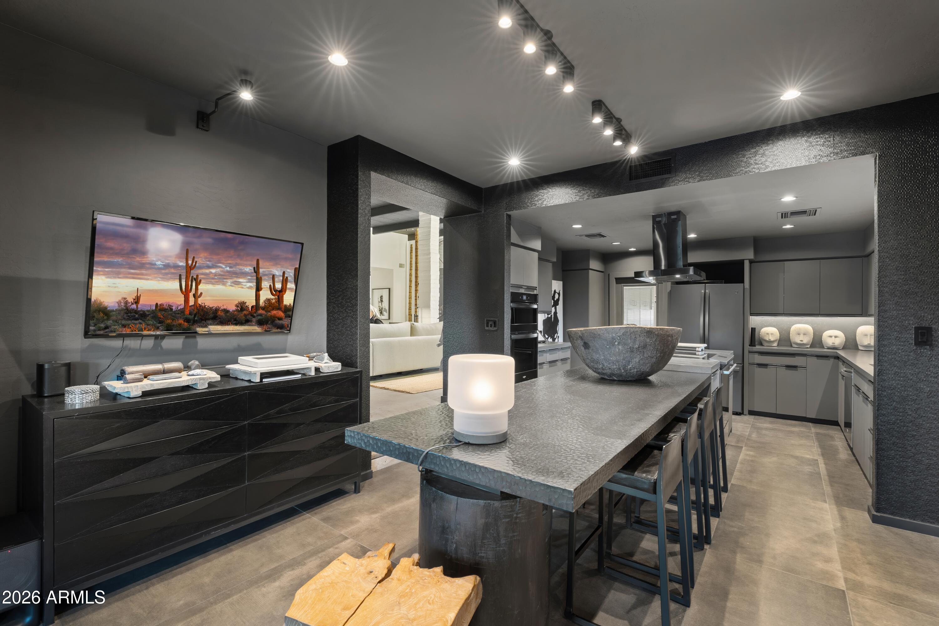 9545 East Romping Road, Unit 90 Carefree, AZ 85377 - Photo 23 of 59 a kitchen and a sink with chairs