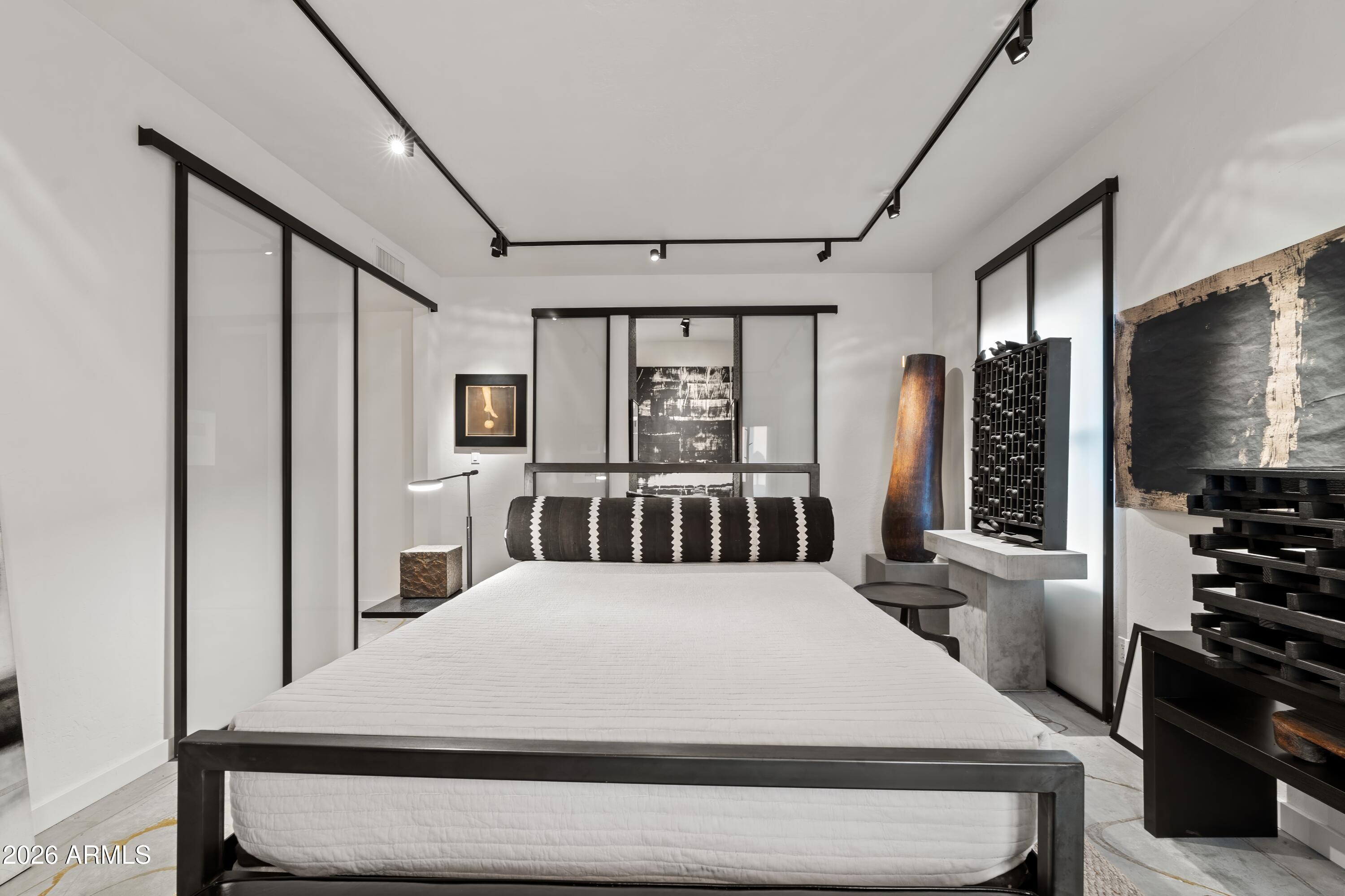 9545 East Romping Road, Unit 90 Carefree, AZ 85377 - Photo 34 of 59 a large white bed in a white room