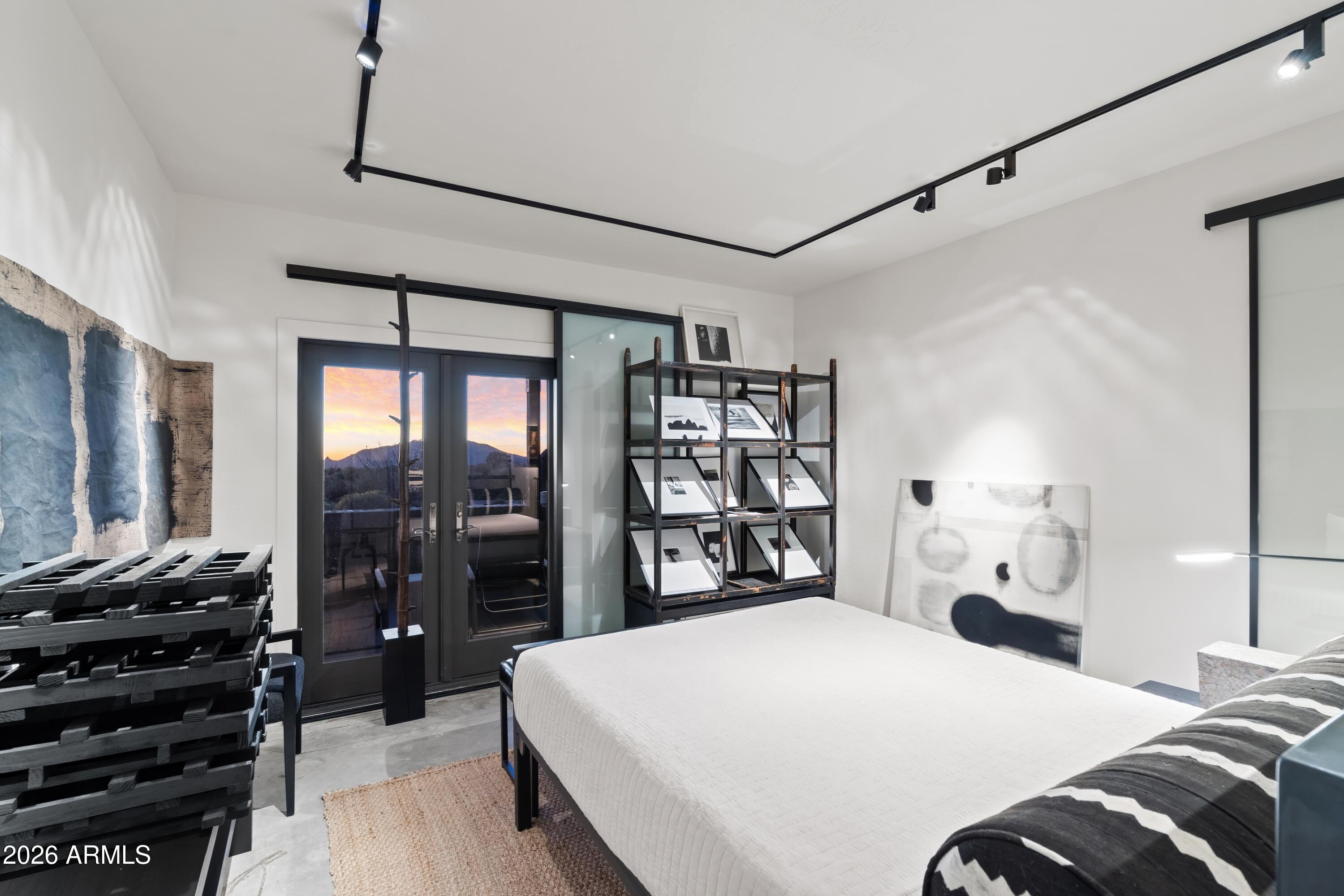 9545 East Romping Road, Unit 90 Carefree, AZ 85377 - Photo 35 of 59 a bedroom with a bed and a flat tv screen