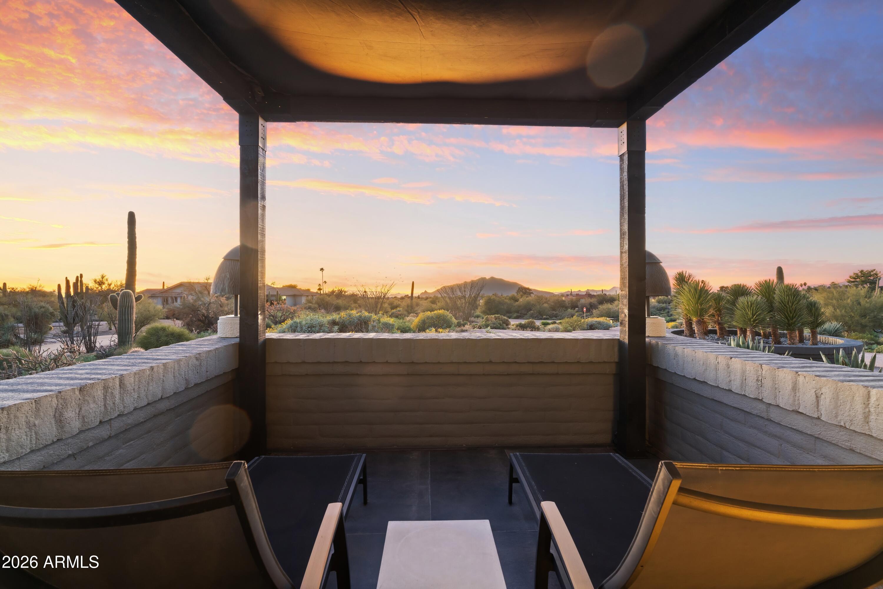 9545 East Romping Road, Unit 90 Carefree, AZ 85377 - Photo 36 of 59 a view of a balcony with couches and wooden floor