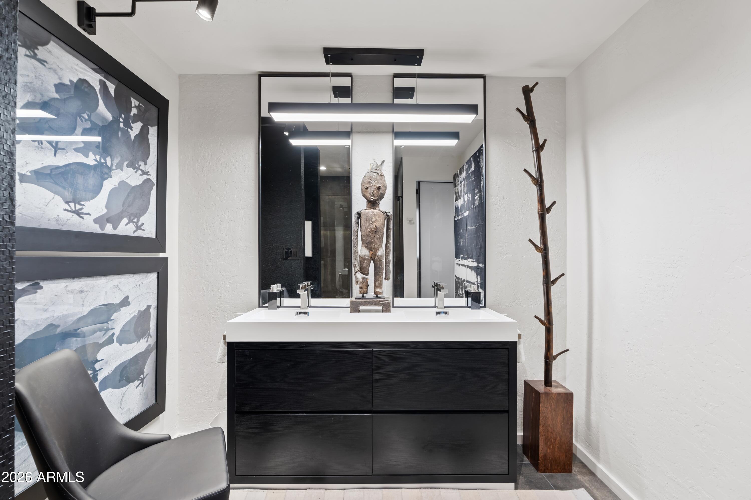 9545 East Romping Road, Unit 90 Carefree, AZ 85377 - Photo 37 of 59 a bathroom with a sink vanity and a mirror