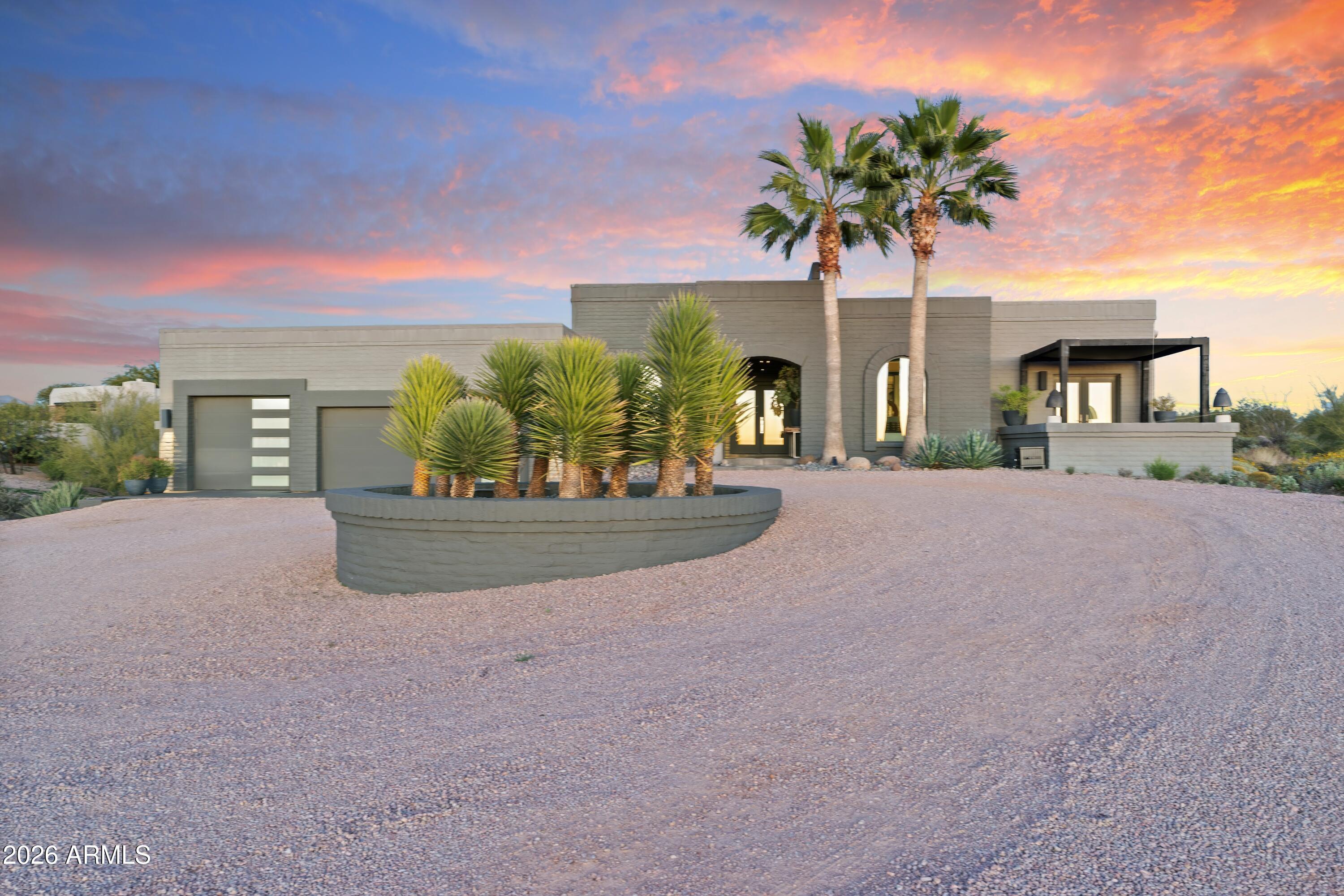 9545 East Romping Road, Unit 90 Carefree, AZ 85377 - Photo 3 of 59 a view of a house with porch and a yard
