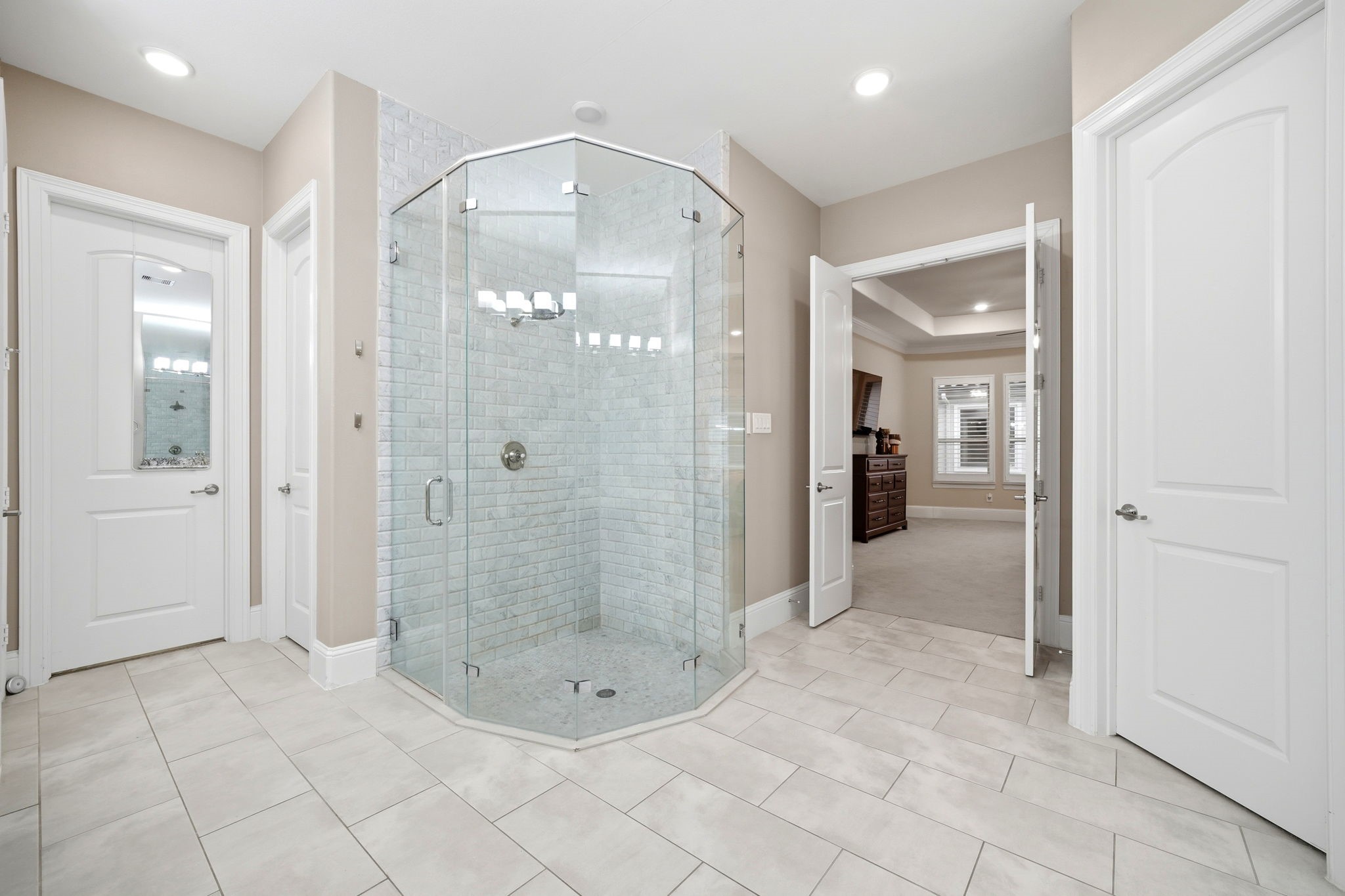 5815 Stratton Woods Drive Spring, TX 77389 - Photo 36 of 45 a bathroom with a glass shower door and mirror