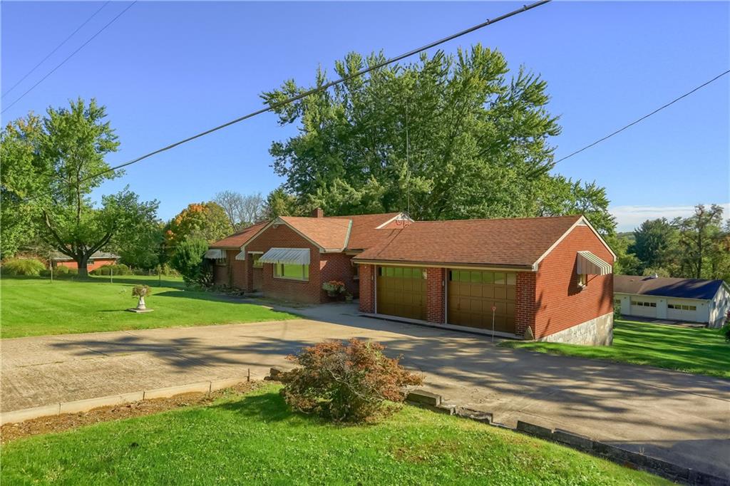 4126 Henderson Road Hickory, PA 15340 - Photo 1 of 25 a view of a back yard of the house