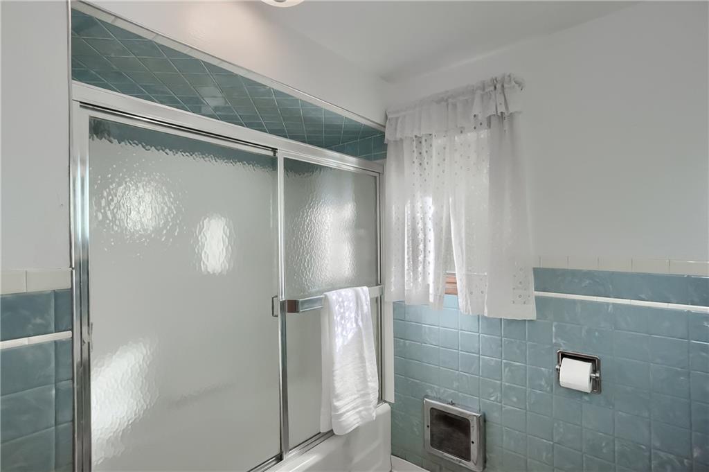 4126 Henderson Road Hickory, PA 15340 - Photo 19 of 25 a bathroom with a shower and a mirror
