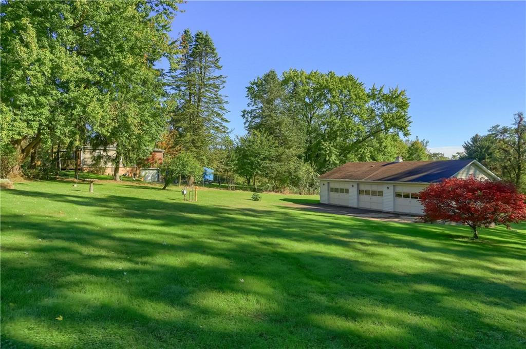 4126 Henderson Road Hickory, PA 15340 - Photo 23 of 25 a front view of a house with a garden