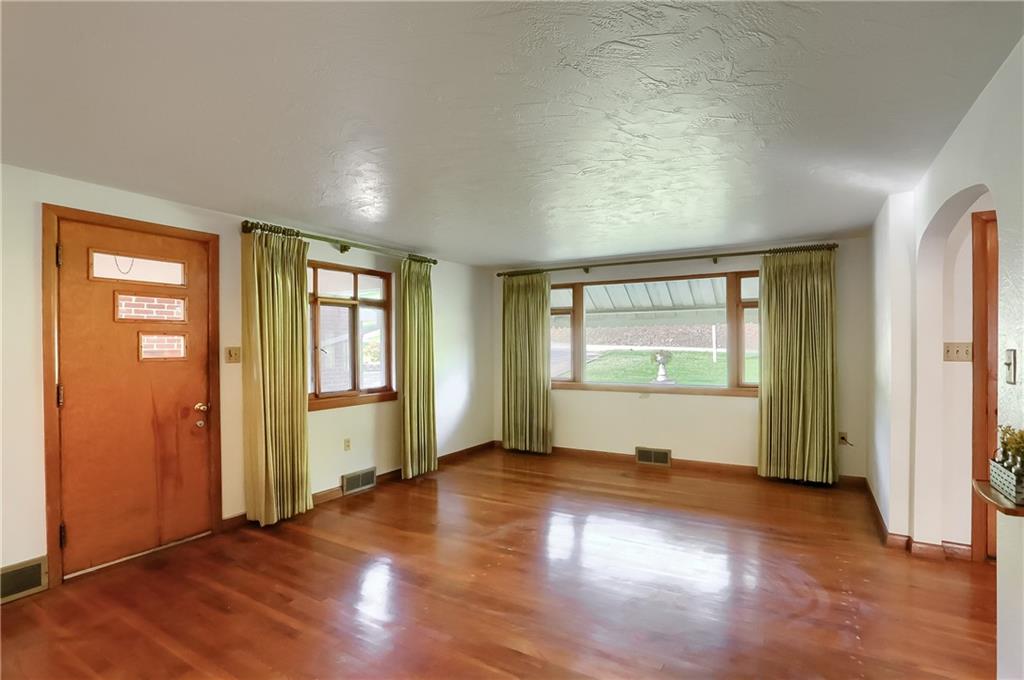 4126 Henderson Road Hickory, PA 15340 - Photo 8 of 25 an empty room with wooden floor and windows