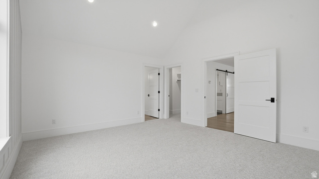 1682 North 1950 W Street, Unit 9 Provo, UT 84604 - Photo 59 of 84 Spacious room featuring vaulted ceilings, light-colored carpet, recessed lighting, and white trim