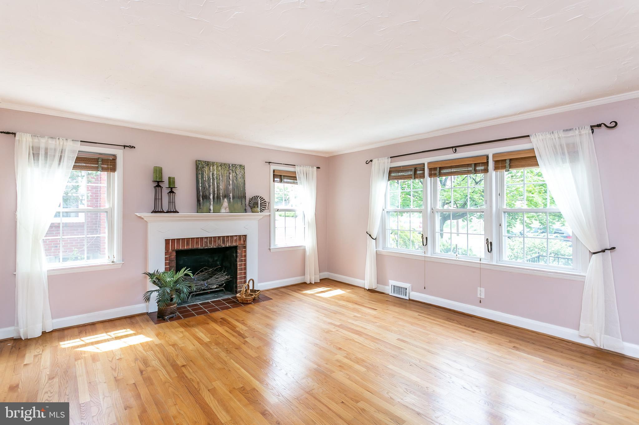 8233 Pleasant Plains Road Baltimore, MD 21286 - Photo 8 of 48 Living Room with wood burning fireplace