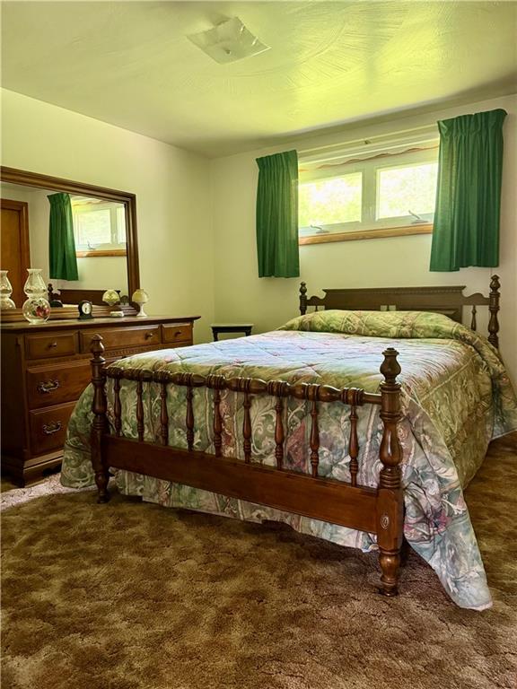 151 Huntingdon Road Wyano, PA 15695 - Photo 21 of 36 a bedroom with a bed and a table in it