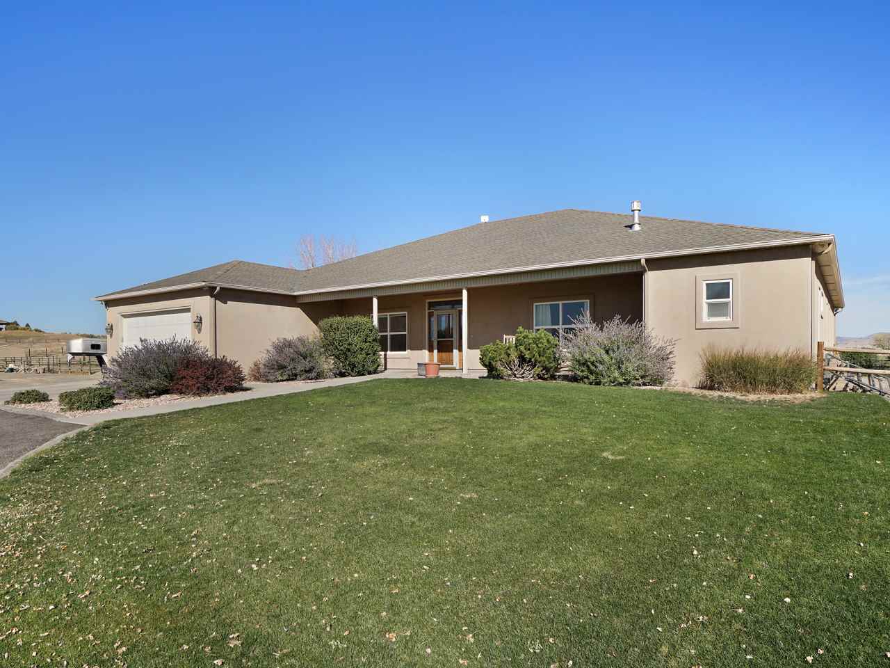1421 19 Road Fruita, CO 81521 - Photo 15 of 36 a front view of a house with garden