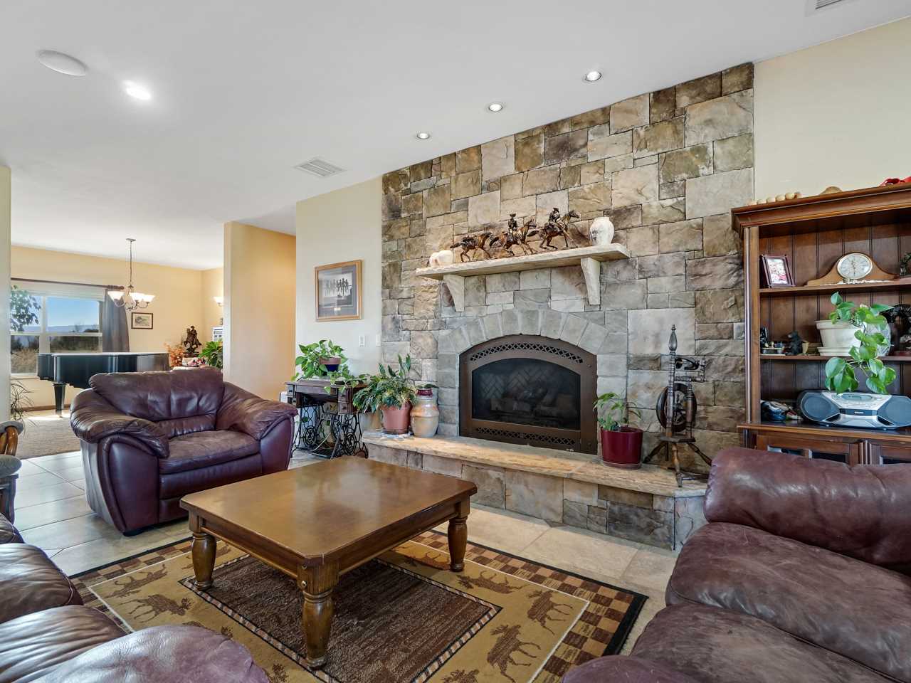 1421 19 Road Fruita, CO 81521 - Photo 23 of 36 a living room with furniture and a fireplace