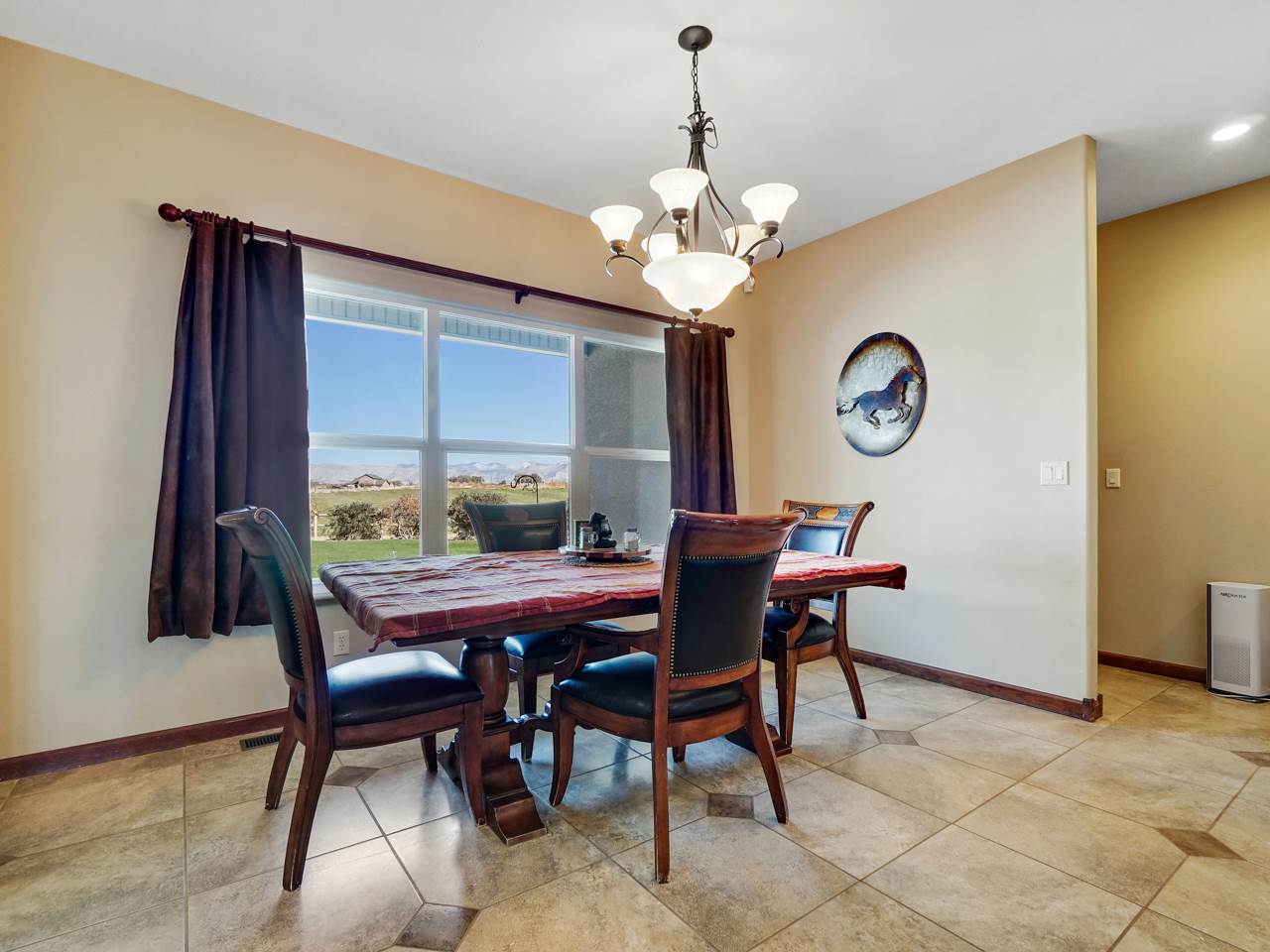 1421 19 Road Fruita, CO 81521 - Photo 28 of 36 a view of a dining room and a table and chairs