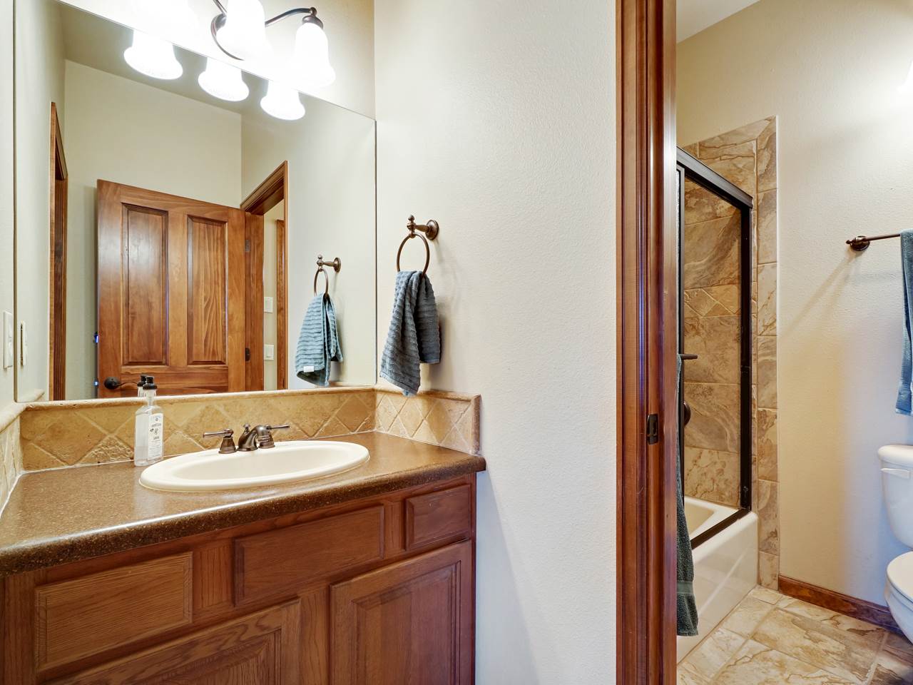 1421 19 Road Fruita, CO 81521 - Photo 30 of 36 a bathroom with a sink vanity and a mirror