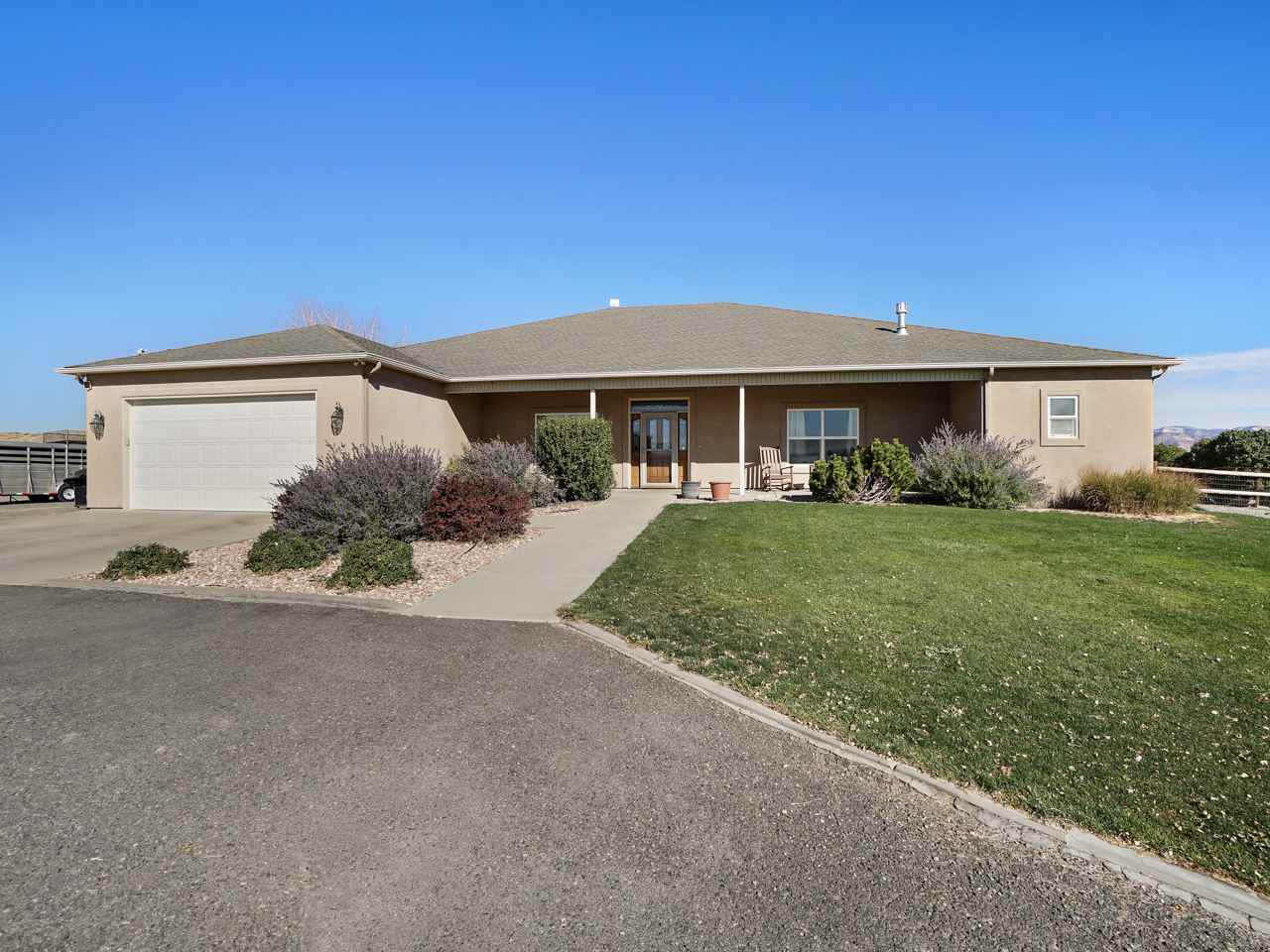 1421 19 Road Fruita, CO 81521 - Photo 3 of 36 a front view of a house with garden