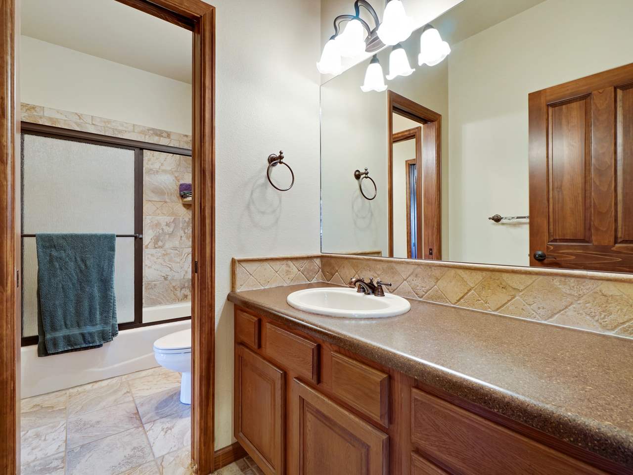 1421 19 Road Fruita, CO 81521 - Photo 31 of 36 a bathroom with a sink and a mirror