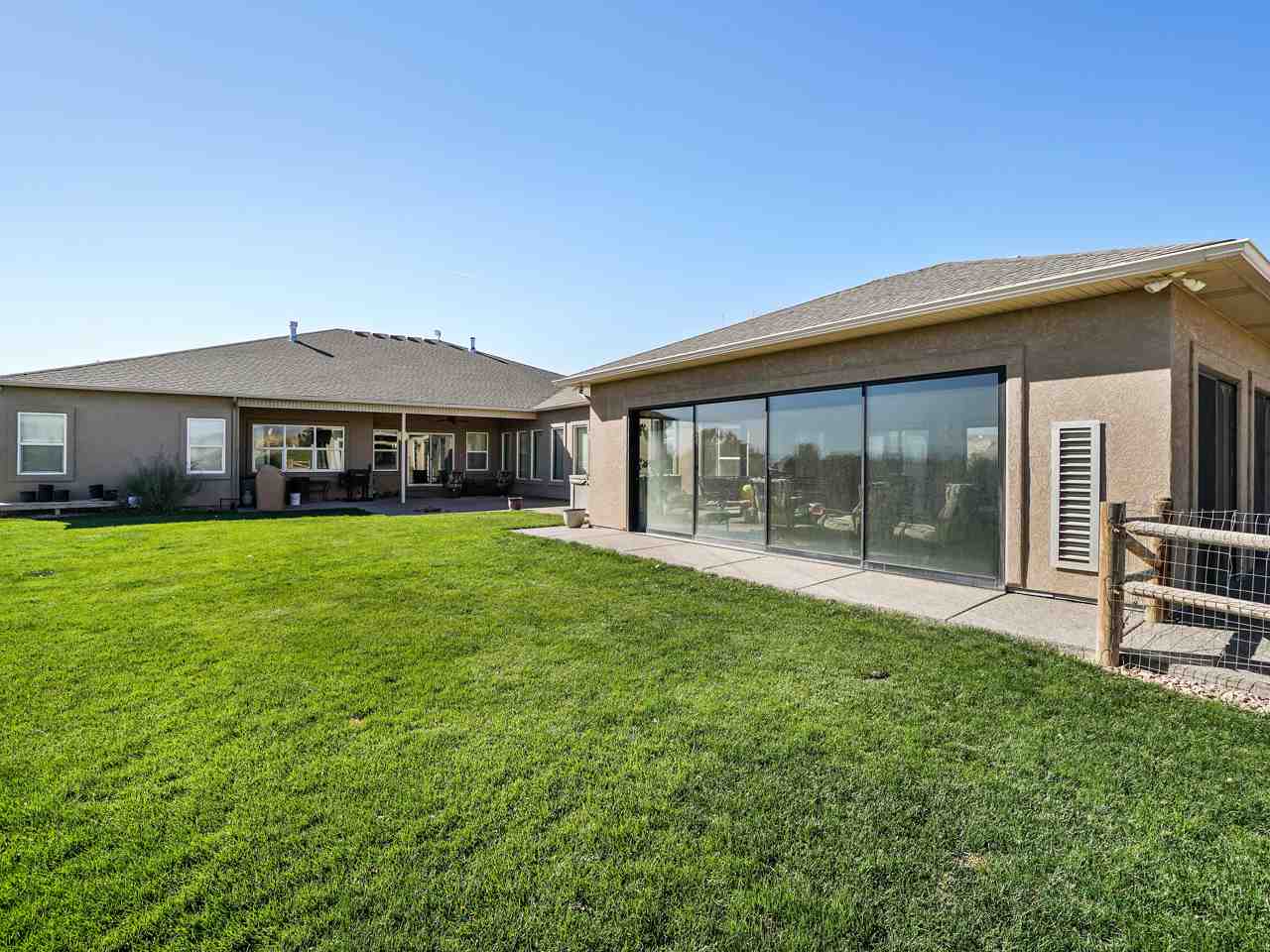 1421 19 Road Fruita, CO 81521 - Photo 4 of 36 a front view of a house with garden