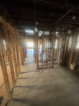 a view of an empty room with wooden walls