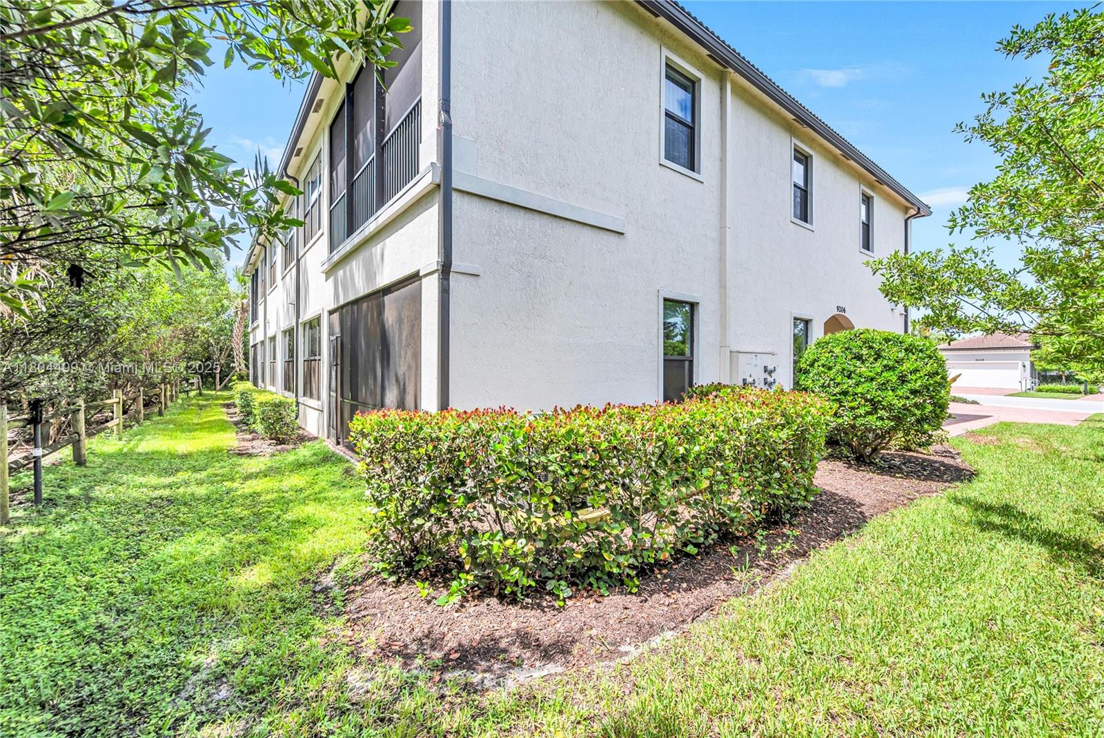 9206 Passiflora Way, Unit 101 Boca Raton, FL 33428 - Photo 13 of 60 a front view of a house with garden