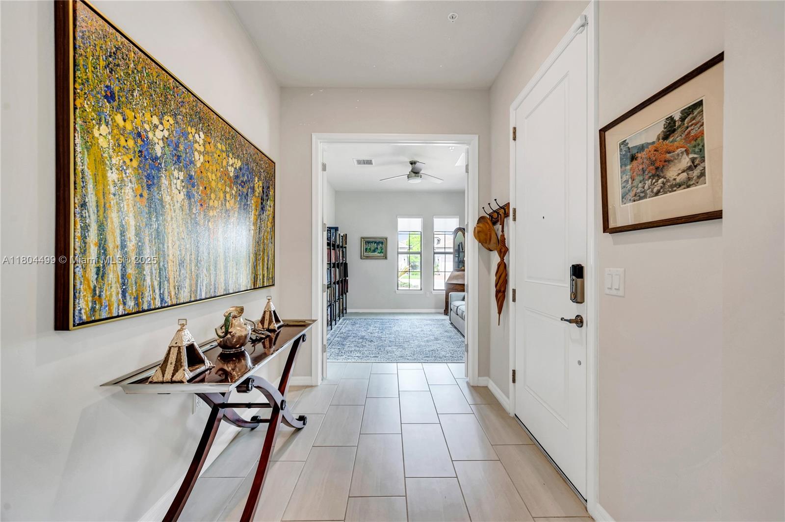 9206 Passiflora Way, Unit 101 Boca Raton, FL 33428 - Photo 34 of 60 a view of a hallway with furniture and front door