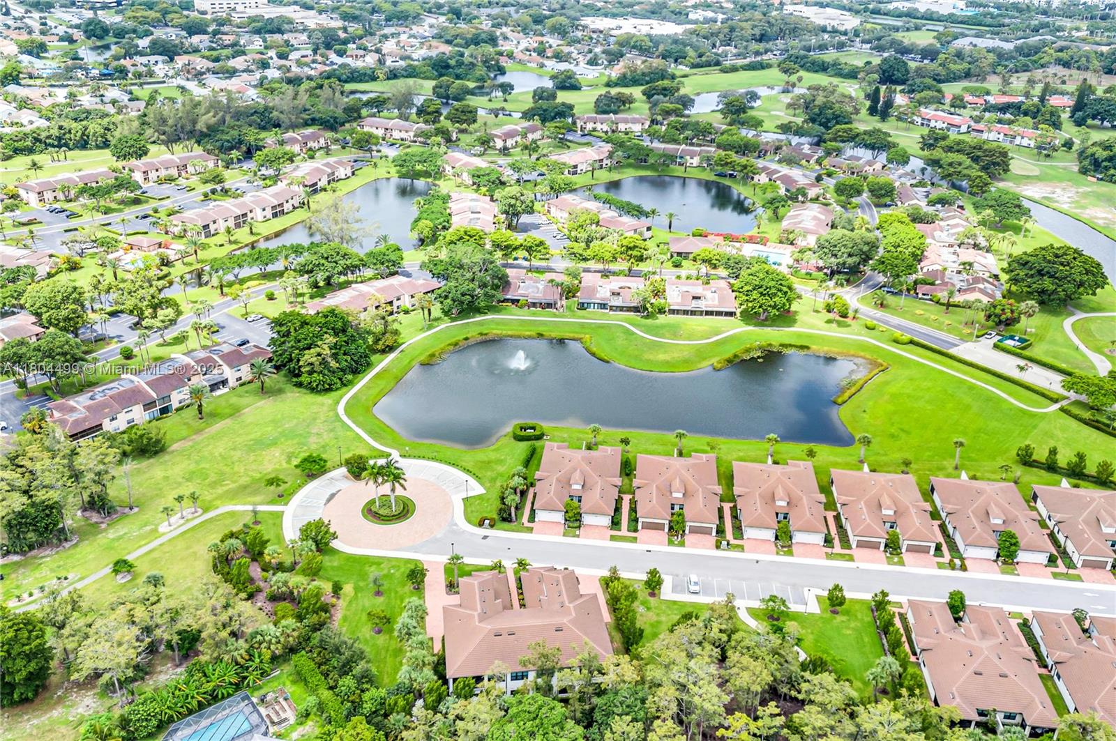 9206 Passiflora Way, Unit 101 Boca Raton, FL 33428 - Photo 57 of 60 an aerial view of a house with yard swimming pool and outdoor seating