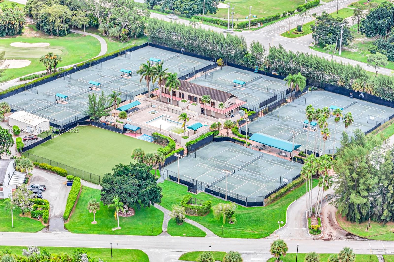9206 Passiflora Way, Unit 101 Boca Raton, FL 33428 - Photo 59 of 60 an aerial view of a tennis ground and a cars park side of the road